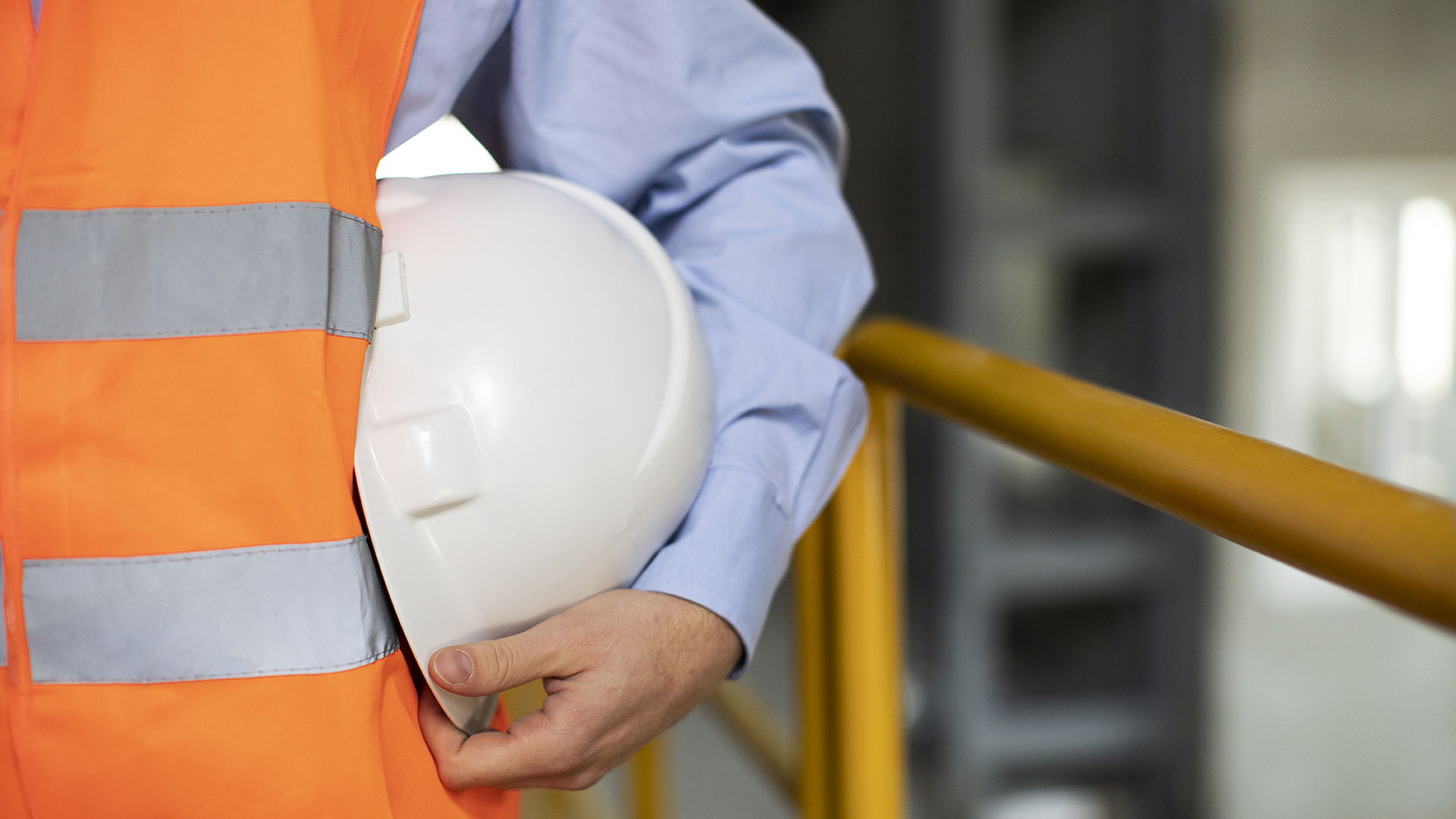 Person with safety vest and helmet